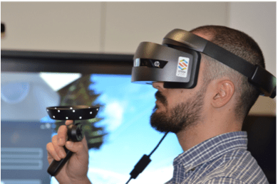 Man seated wearing a virtual reality headset